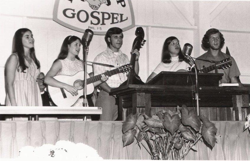 A group of teenagers from the Brethren in Christ Church play folk music instruments during a concert