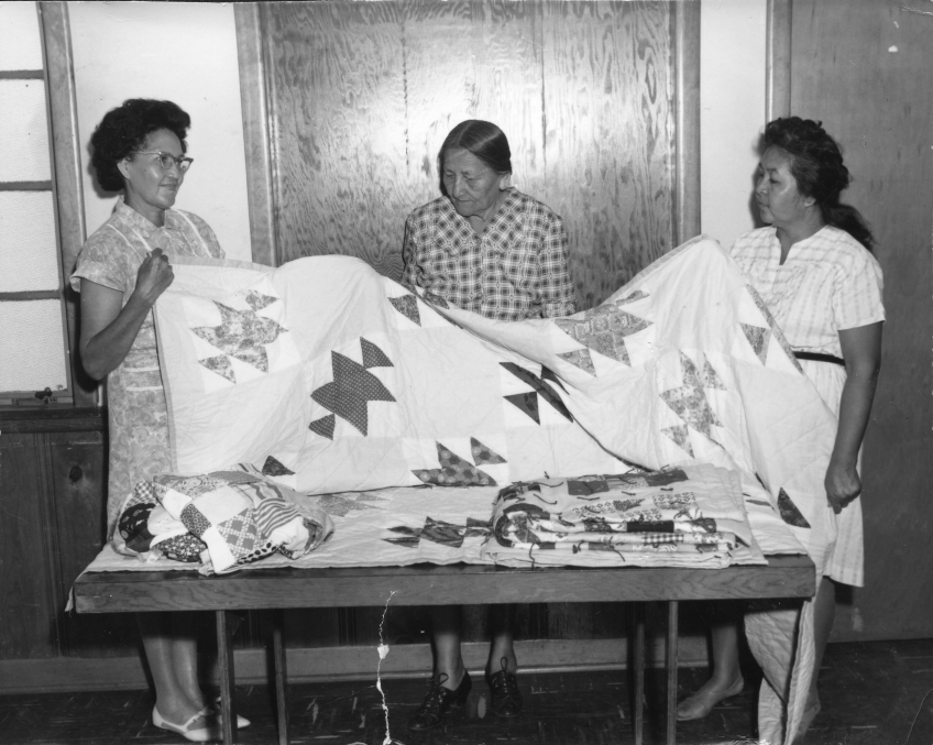 Cheyenne women with quilt, Star Mission Club, Clinton, OK, 1960